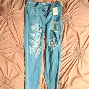 Light blue denim ripped mom jeans.